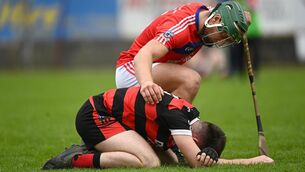 <p>Cappataggle's Dan Nevin is consoled by Fintan Burke of St Thomas' at Kenny Park, Athenry. Photo by Harry Murphy/Sportsfile</p>