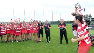 <p>HISTORY MAKERS: Karyn Keohane, Courcey Rovers Captain, lifts the SE Systems Cork senior camogie championship cup aloft. Picture: Jim Coughlan.</p>