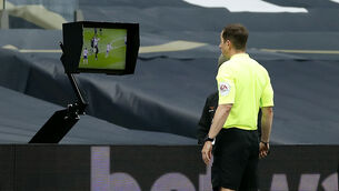 <p>Referee Peter Bankes checks the VAR pitch side monitor before giving a penalty for a handball against Tottenham Hotspur's Eric Dier. Picture:  Andrew Boyers/NMC Pool/PA Wire. </p>