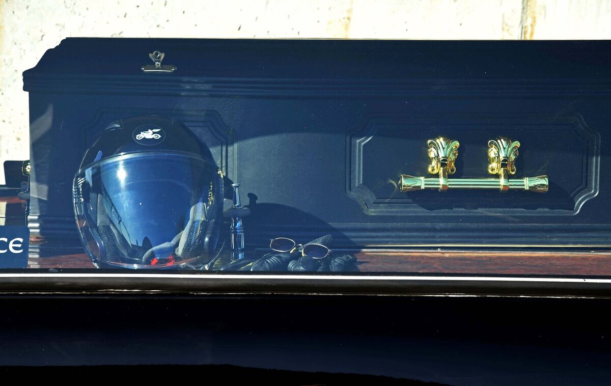 A motorcyclist's helmet and gloves alongside a coffin in Pat Noonan's trike hearse. Picture: Denis Minihane