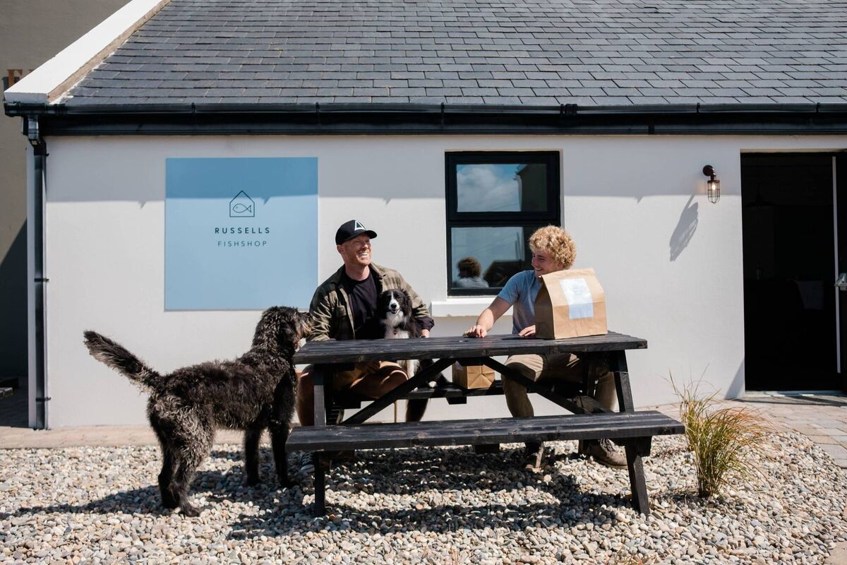 Customers at Russells: Wayne and Donagh, with dogs, Dougal and Winter