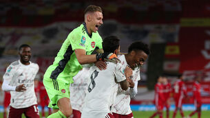 <p>Arsenal's Joe Willock (right) is congratulated on scoring the winning penalty in the shoot-out during the Carabao Cup fourth round match at Anfield, Liverpool.</p>