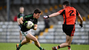 <p>Mark Cronin of Nemo Rangers in action against Micheal Mahoney of Duhallow during the Cork Premier SFC semi-final. Cronin kicked an injury-time winner for the defending champions. Picture: Sam Barnes/Sportsfile</p>