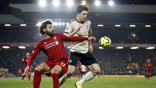 <p>Liverpool's Mohamed Salah and Manchester United's Harry Maguire battle for the ball at Anfield last January. <span class="contextmenu emphasis">Photo: Martin Rickett/PA Wire. </span>
            </p>
