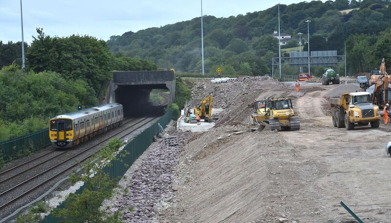 The Cobh to Cork train passes as work on the Dunkettle interchange takes place in Cork. Picture: Dan Linehan