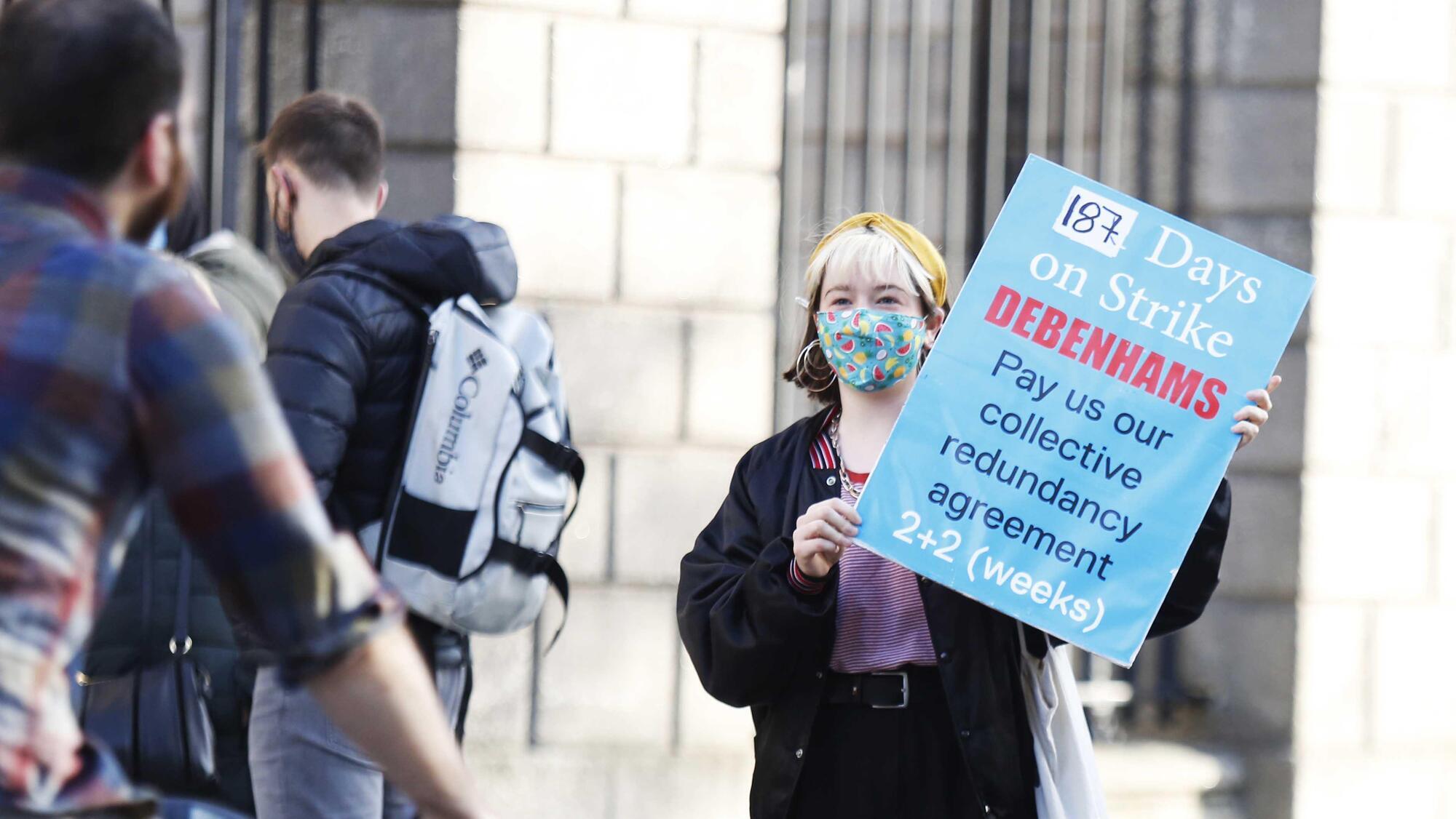 A former Debenhams employee protests outside the Four Courts as Debenhams' liqudators seek High Court injunctions today. Photo: RollingNews.