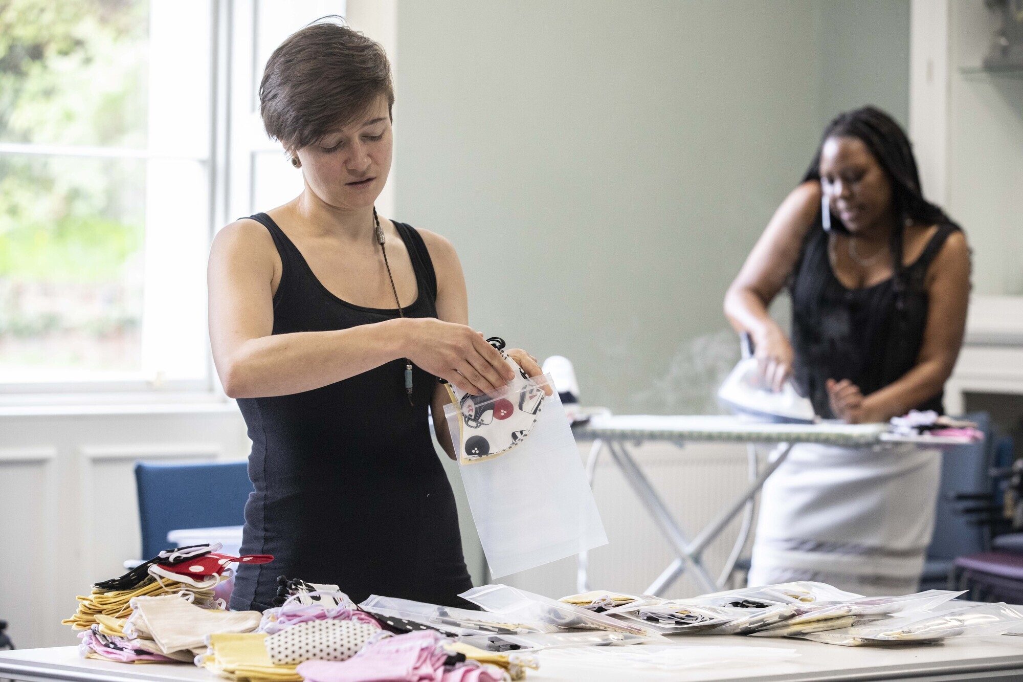 Vera Stojanovic of BetterTogetherCork and Dr Naomi Masheti, co-ordinator, packaging masks at Cork Migrant Centre.  Picture: Clare Keogh