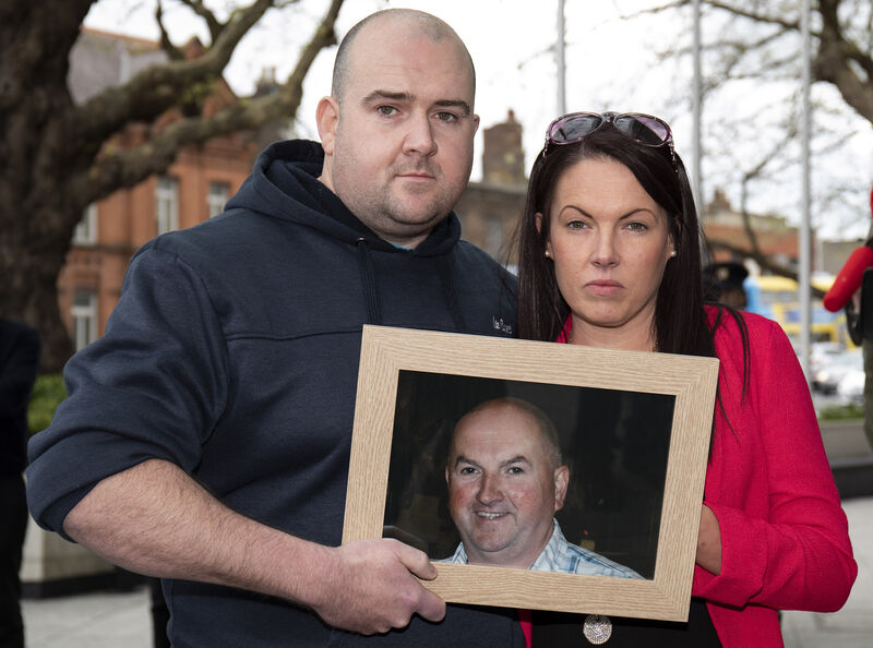 Robert and Michelle Ryan with a photo of their murdered father, Bobby Ryan, outside court last year. File photo: Collins Robert and Michelle Ryan with a photo of their murdered father, Bobby Ryan, outside court last year. File photo: Collins