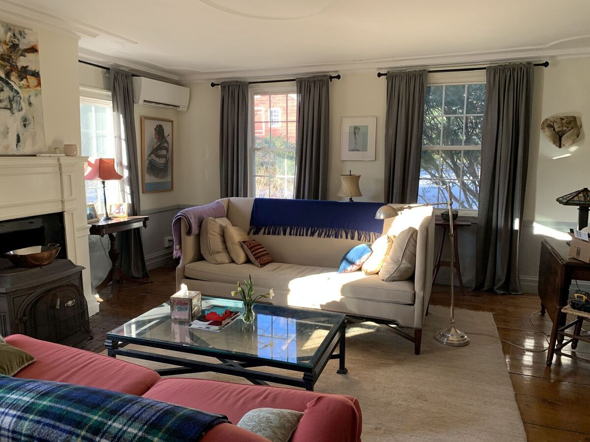 A year ago this living room was a damp dreary shell, now transformed into a lightsome space for comfort and relaxation, blending vintage furniture with contemporary art and family photos. A year ago this living room was a damp dreary shell, now transformed into a lightsome space for comfort and relaxation, blending vintage furniture with contemporary art and family photos.