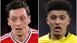 <p>Mesut Ozil and Jadon Sancho (John Walton/Adam Davy/PA)</p>