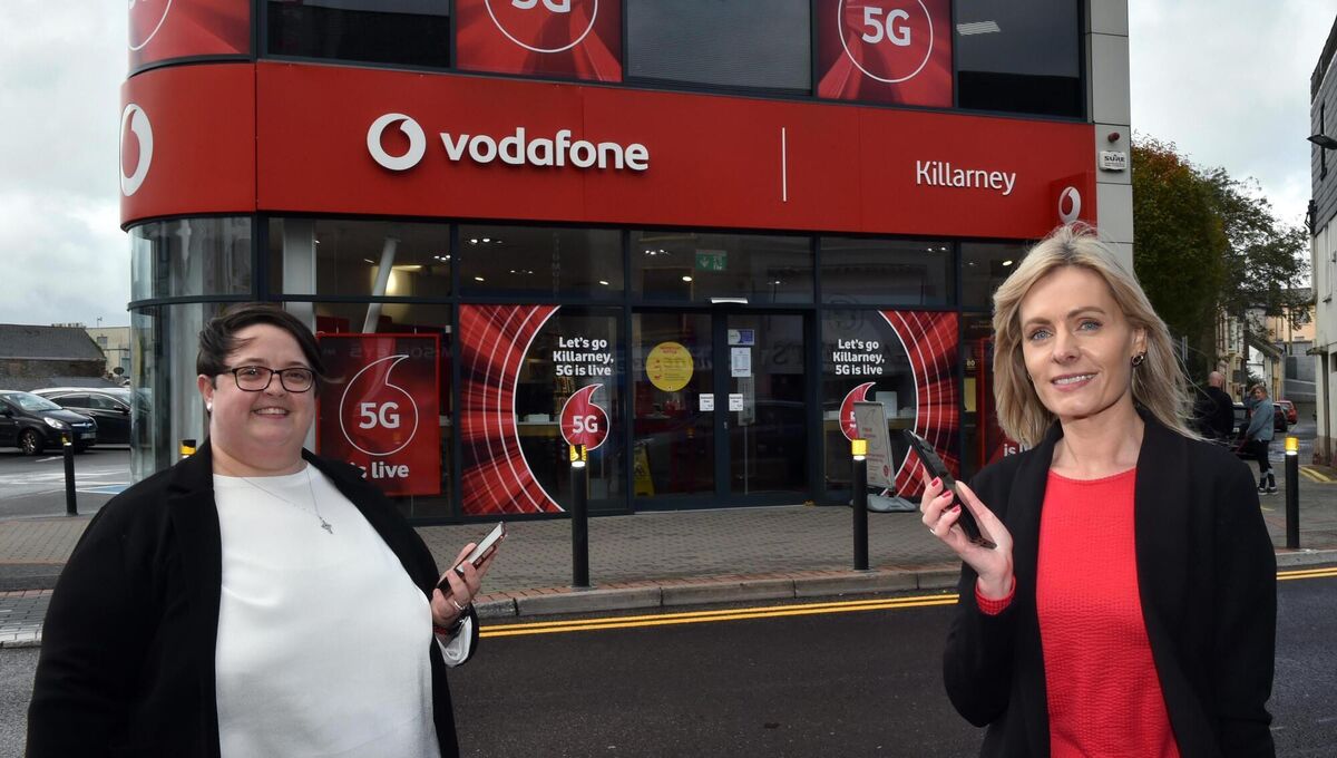  Carolanne Kissane and Jessica O'Connor outside Vodafone, Killarney, key partners in helping Rosemary O'Connor and other business owners boost their growth.
