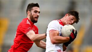 <p>TO HAVE AND HOLD: Cork’s Colm O’Callaghan shields possession from Louth’s Patrick Reilly during Saturday’s Allianz FL match at Páirc Uí Chaoimh. O’Callaghan scored the first of Cork’s five goals. <span class="contextmenu emphasis CaptionCredit">	Picture: Harry Murphy/Sportsfile</span>
            </p>