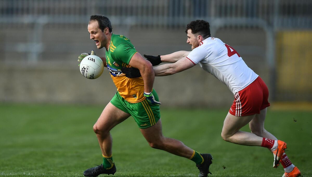 Michael Murphy of Donegal in action against Rory Brennan of Tyrone. Photo by David Fitzgerald/Sportsfile