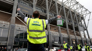 <p>A man collects for the NUFC Food Bank before the Premier League match against Cardiff in January 2019 (Richard Sellers/PA)</p>