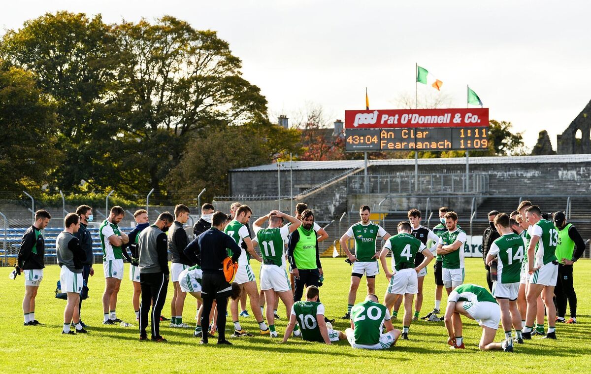 Fermanagh manager Ryan McMenamin speaks to his players after the match.
