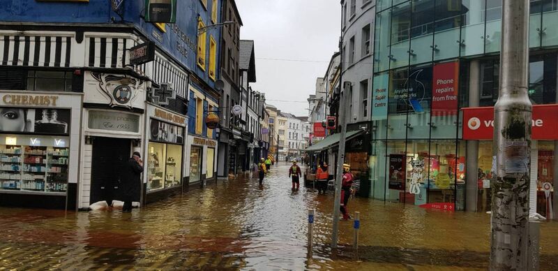 Flooding along Oliver Plunkett Street this morning. Picture: Stephen Rogers