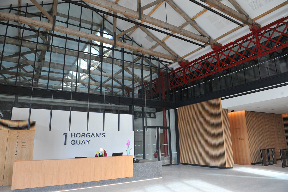 The double height foyer in No 1 Horgan's Quay with original wooden trusses and steel columns from the Goods Shed. The double height foyer in No 1 Horgan's Quay with original wooden trusses and steel columns from the Goods Shed.
