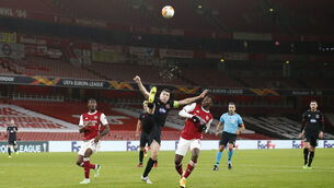 <p>Brian Gartland of Dundalk in action against Eddie Nketiah, right, and Ainsley Maitland-Niles of Arsenal. Picture: Matt Impey/Sportsfile</p>