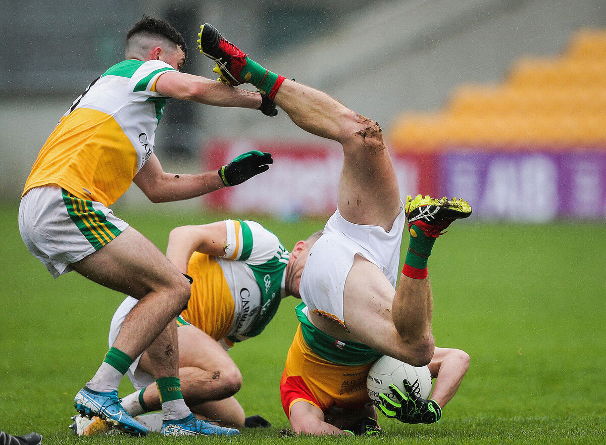 Carlow’s Paul Broderick with Ruari McNamee and Anton Sullivan of Offaly. Picture: INPHO