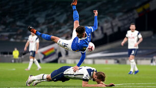 <p>Brighton’s Adam Lallana (top) brings down Tottenham’s Harry Kane inside the box, resulting in a penalty.</p>