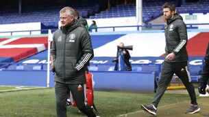 <p>Manchester United manager Ole Gunnar Solskjaer (left) and first team coach Michael Carrick walk out for the Premier League match at Goodison Park, Liverpool.</p>