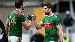<p>Lee Keegan, right, and Aidan O'Shea of Mayo fist bump following the win. Picture: Harry Murphy/Sportsfile</p>
