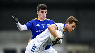 <p>Trevor Collins of Laois is tackled by Iarla O'Sullivan of Longford. Picture: Ray McManus/Sportsfile</p>
