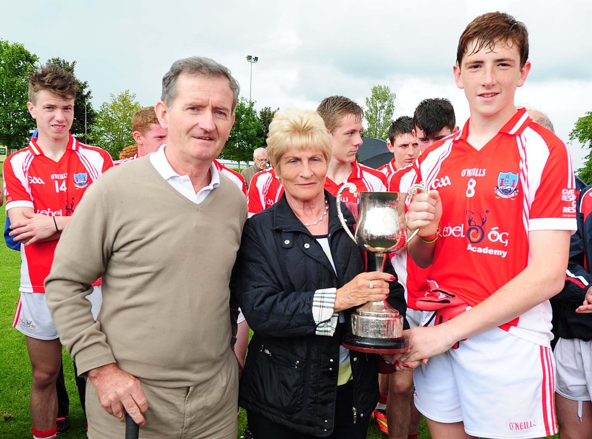 Cork captain Mark Keane receives the Munster U15 Humphrey Kelleher Cup from Mai Kelleher and Richard Murphy in 2015. Picture John Tarrant