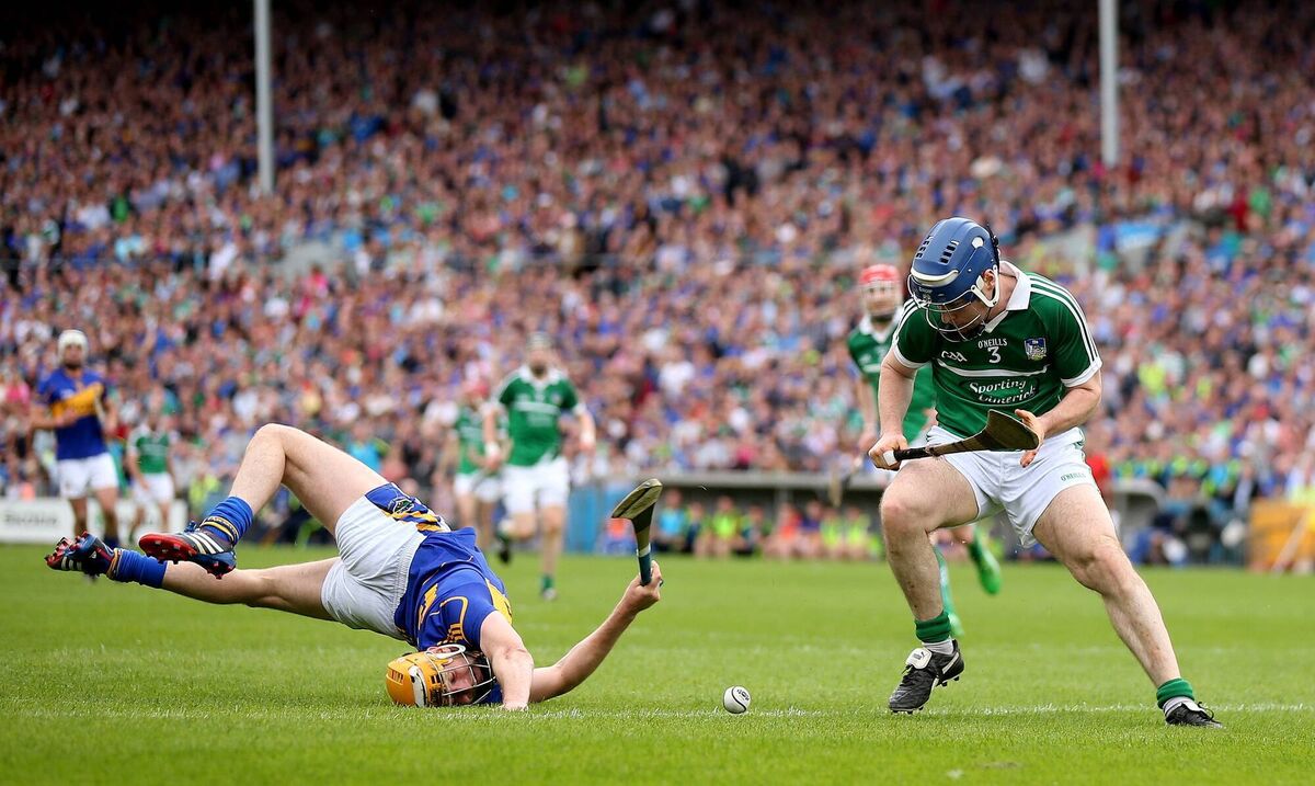Richie McCarthy gets the ball off Seamus Callanan during the 2014 Munster SHC clash. Picture: INPHO/James Crombie