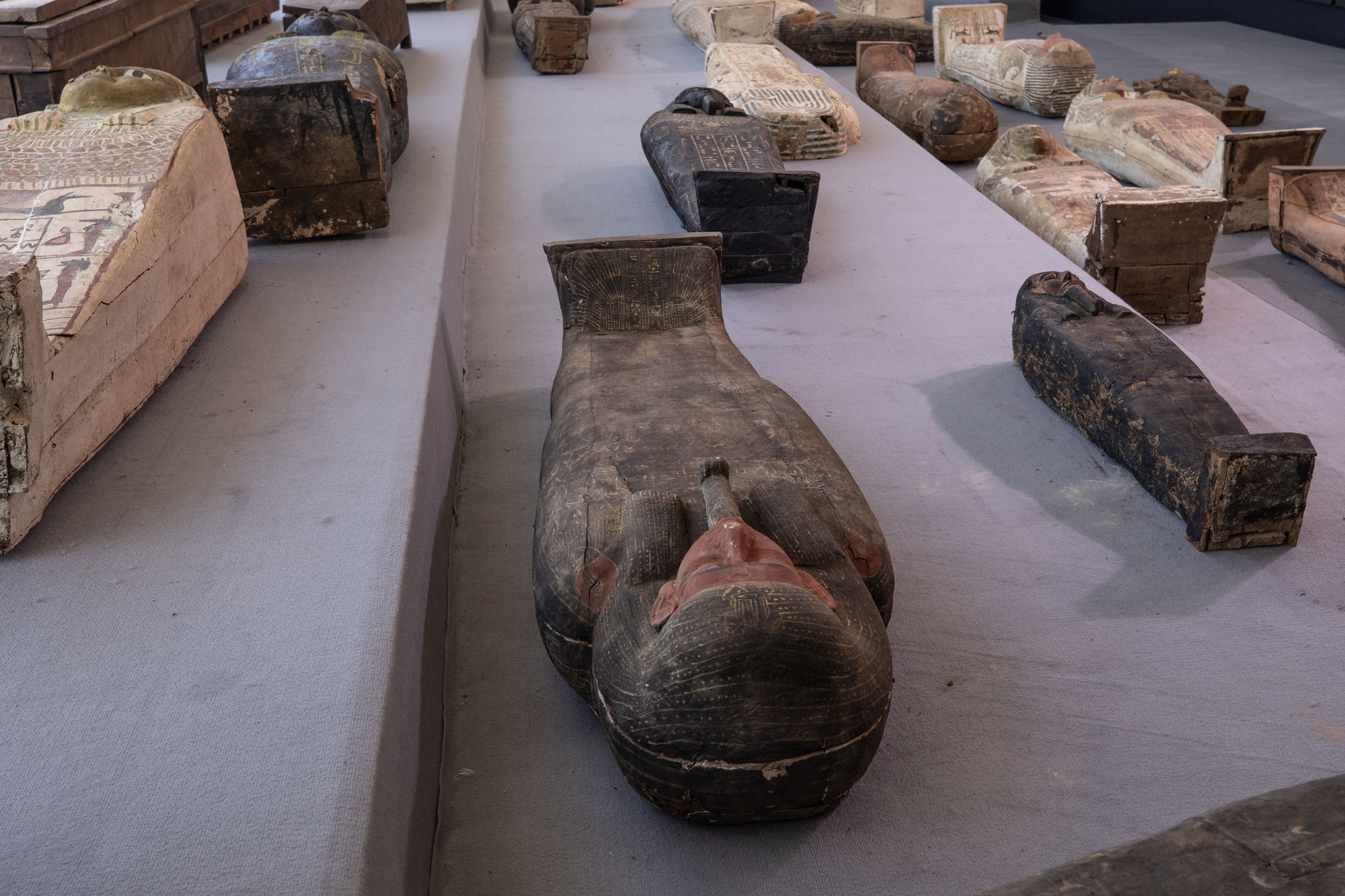Egypt unveils ancient coffins and mummies found in huge necropolis
