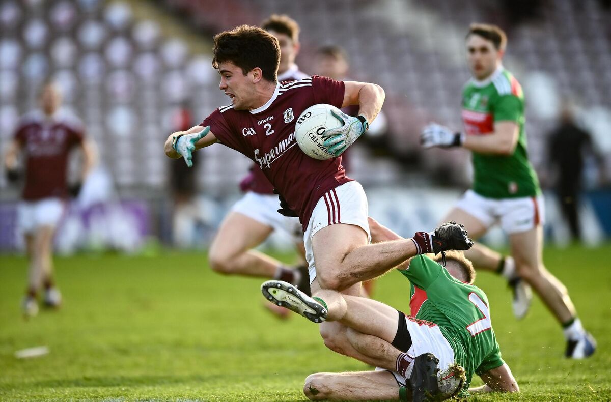 Sean Kelly of Galway is tackled by Eoghan McLaughlin of Mayo. Picture: David Fitzgerald/Sportsfile