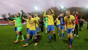 <p>Longford players celebrate after the game </p>