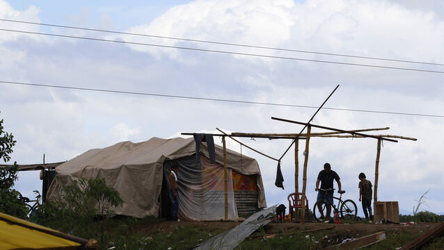 People living under precarious conditions make preparations before Hurricane Iota makes landfall in San Manuel Cortes, Honduras (Delmer Martinez/AP)