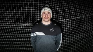 <p>Alan Daly gets ready for a run on a cold November night at Donard/Glen GAA pitch. Picture: Dave Barrett</p>