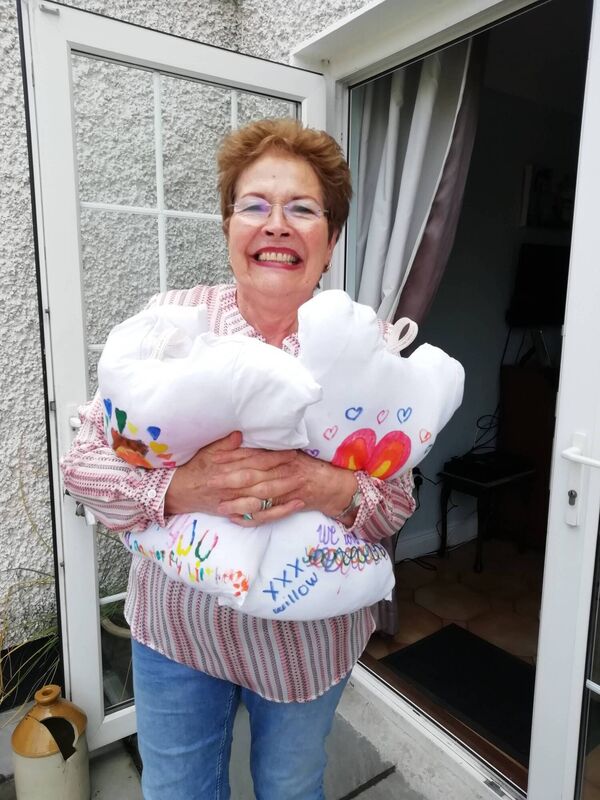 Maura Brierton with hug cushions made from her grandchildren's t-shirts. Maura Brierton with hug cushions made from her grandchildren's t-shirts.
