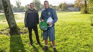 <p>Postman James Mc Sweeney on his rounds in Green Lawn, Cork City with writer Pat Fitzpatrick</p>