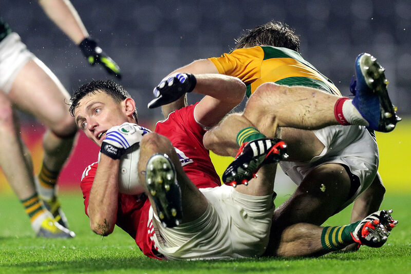 Cork's Mark Collins and Gavin White of Kerry. Picture: INPHO/Laszlo Geczo