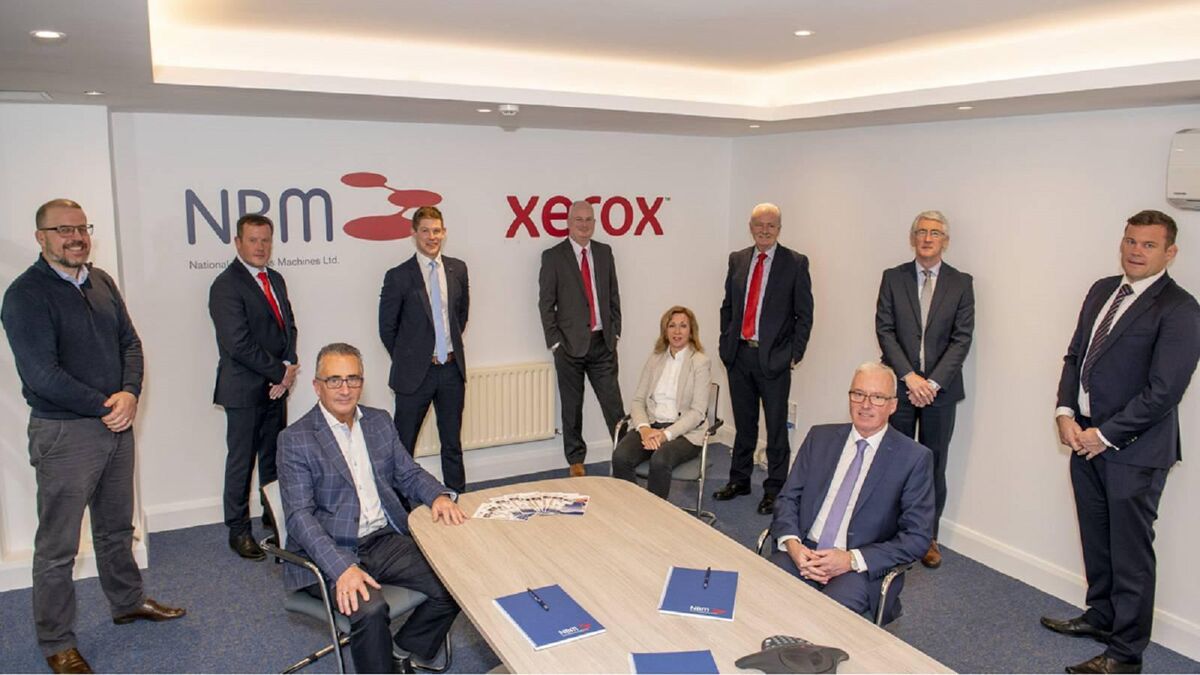 Don Mullins and Michael Galvin (seated) with some key members of the team at National Business Machines, which is celebrating 35 years in business this year.