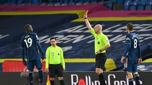 <p>Arsenal's Nicolas Pepe (left) shown a red card by match referee Anthony Taylorduring the Premier League match at Elland Road, Leeds.</p>