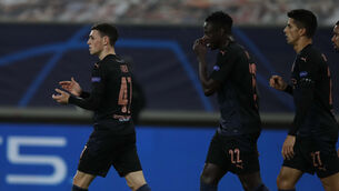 <p>Phil Foden, left, celebrates his goal (Thanassis Stavrakis/AP)</p>