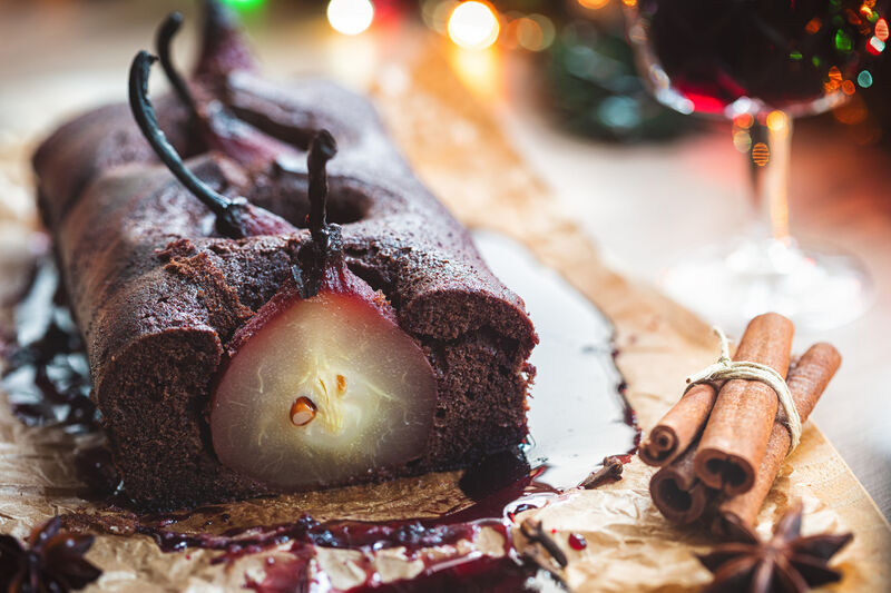 Homemade chocolate cake with pears poached in red wine glaze Homemade chocolate cake with pears poached in red wine glaze
