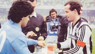 <p>Meeting of Maestros: Ascoli's Liam Brady exchanges pennants with Napoli captain Diego Maradona</p>