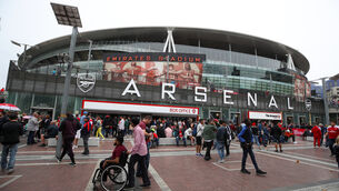 <p>Fans arrive at the Emirates Stadium. Picture: Nick Potts/PA</p>