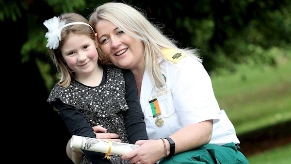 Olive Murphy who received a certificate at The National Bravery Award at Farmleigh with her daughter Isabelle, 5.