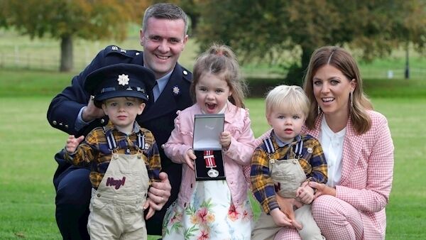 Garda Sean Breheny from Dublin who was awarded a Certificate of Bravery and Silver Medal pictured with his family, twins, Ruan (2), left, and Sé (2), Anna (5) and his wife, Claire.