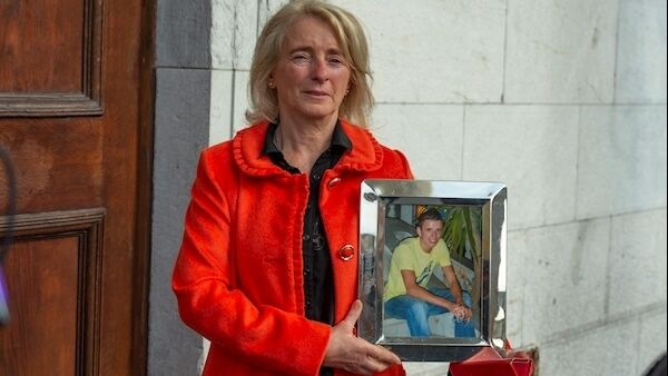 Mary Tyner holds a photo of Jack outside Cork Court. Picture: Provision