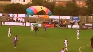 Football fan invades pitch - from above