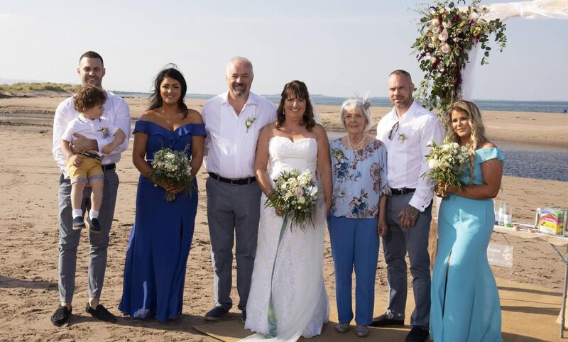 Anne Kelliher and Glyn Wells; with Anne's son, Darragh Kelliher holding Logan Kelliher O'Brien; Michaela Kelliher, Margaret O'Connor, and Jamie and Alanna Kelliher.