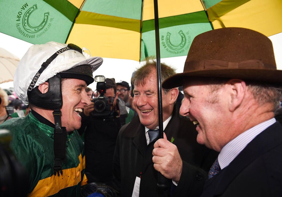 Barry Geraghty celebrates with owner JP McManus and Frank Berry, right, after winning the Galway Hurdle on Tigris River in 2017. Photo by Cody Glenn/Sportsfile