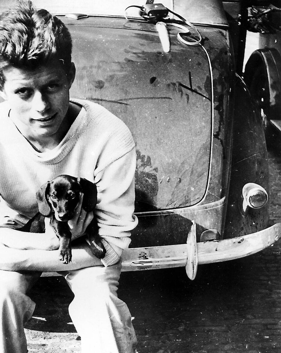 John F. Kennedy tours Europe in the summer of 1937. The Hague, Kennedy with doggy friend Dunker.